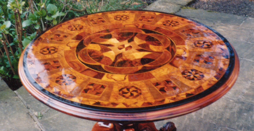 Photo of restored table with intricate marquetry